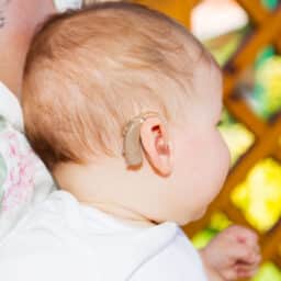 Baby with hearing aid