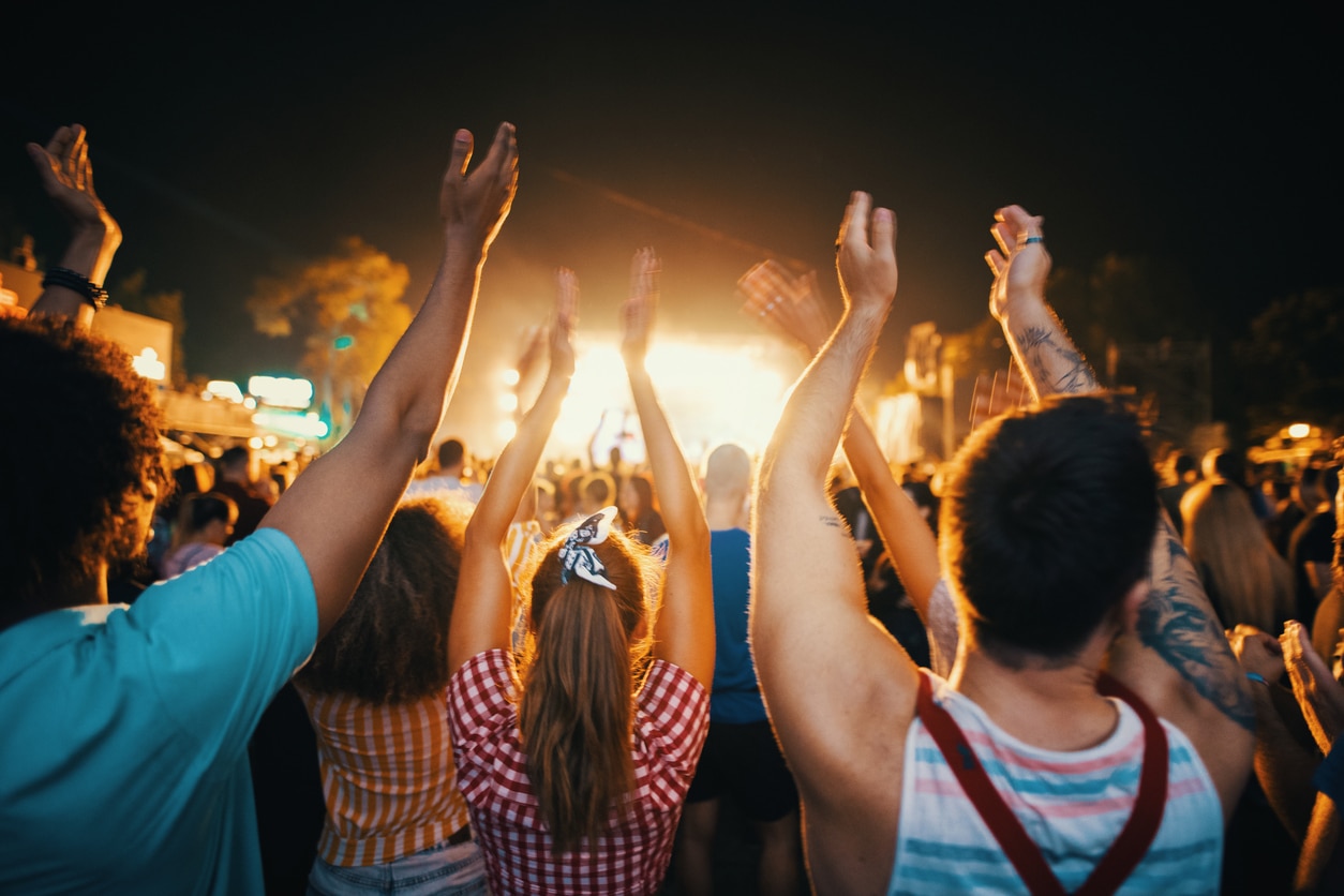 Friends dancing at a concert.