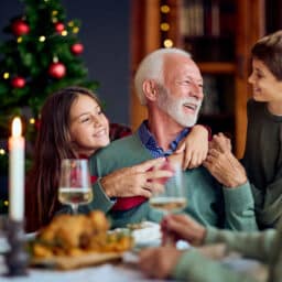 l Family Christmas Dinner With Grandfather And Grandchildren, Warm Celebration By Holiday Tree